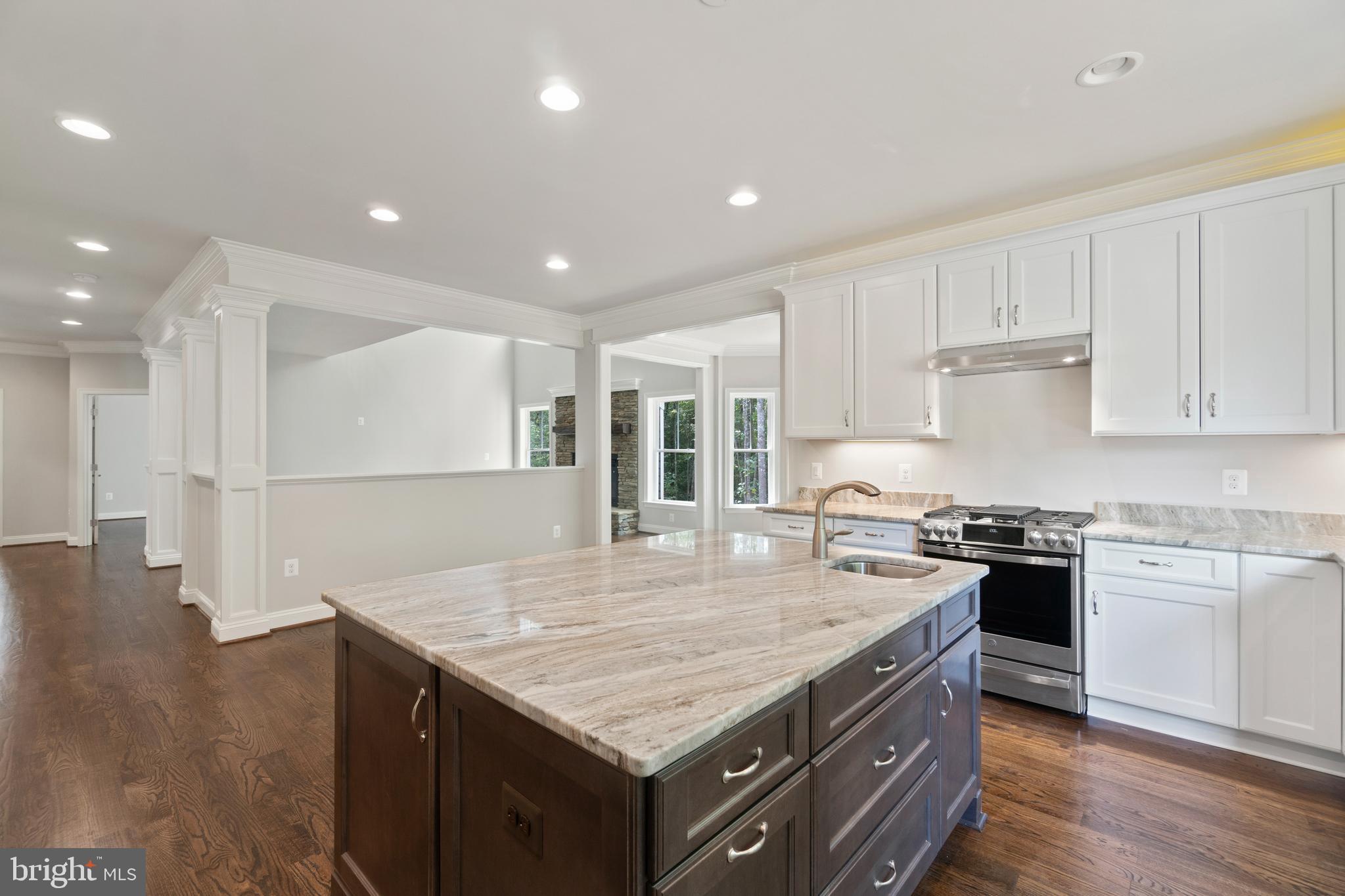 13741 Orlando Road Nokesville, VA 20181 - Photo 17 of 41 a kitchen with kitchen island a sink stainless steel appliances and white cabinets