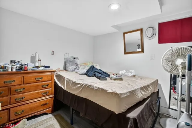 a bedroom with a bed and a table in it