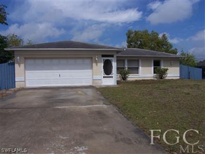 8321 Wren Road Fort Myers, FL 33967 - Photo 1 of 10 a front view of a house with garden