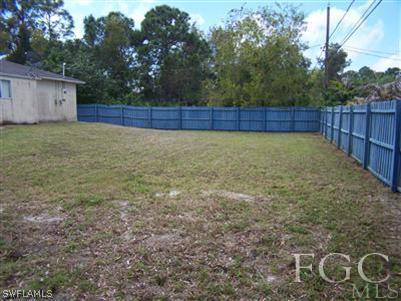 8321 Wren Road Fort Myers, FL 33967 - Photo 4 of 10 a view of yard with wooden fence