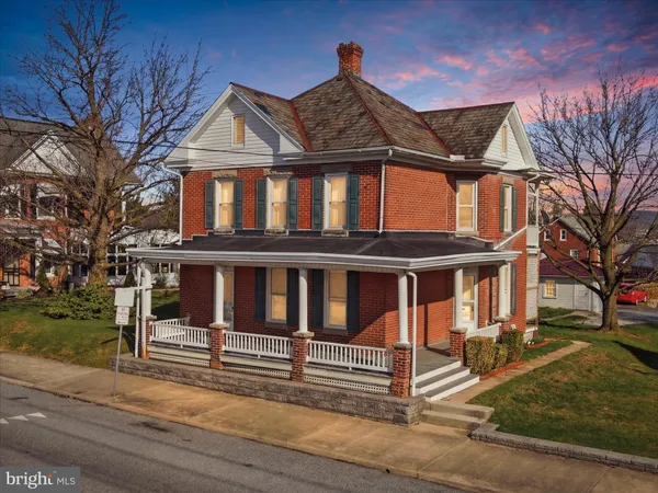 a front view of a house with a porch