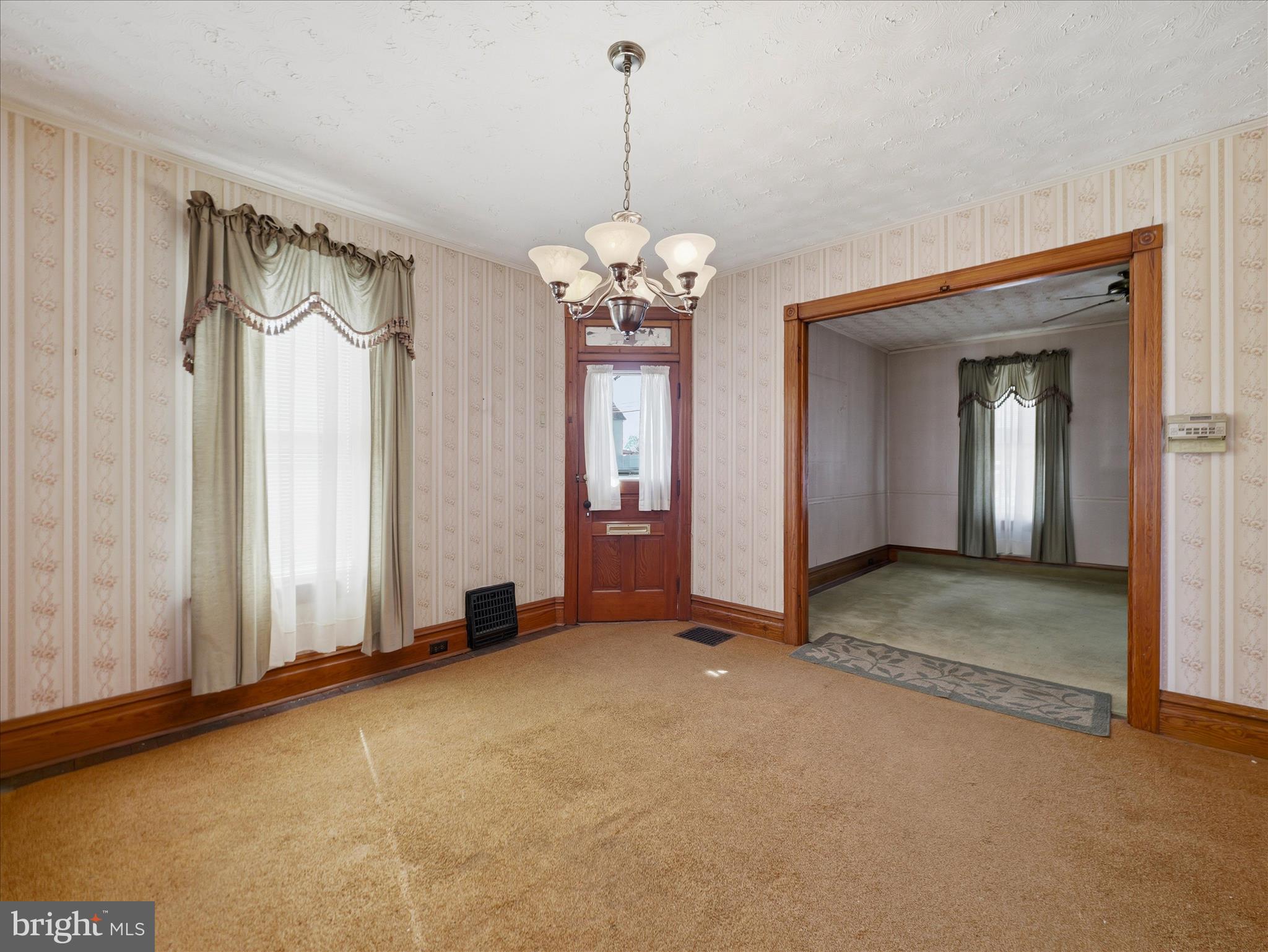 231 Fairview Avenue Waynesboro, PA 17268 - Photo 23 of 45 a view of a big room with chandelier front door and windows