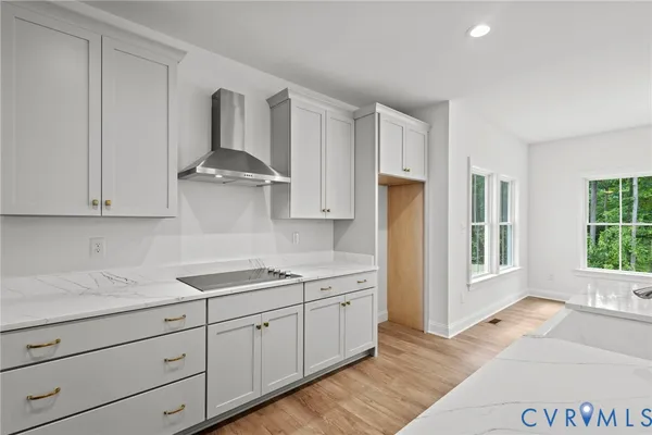 a kitchen with stainless steel appliances granite countertop a sink a stove and a refrigerator