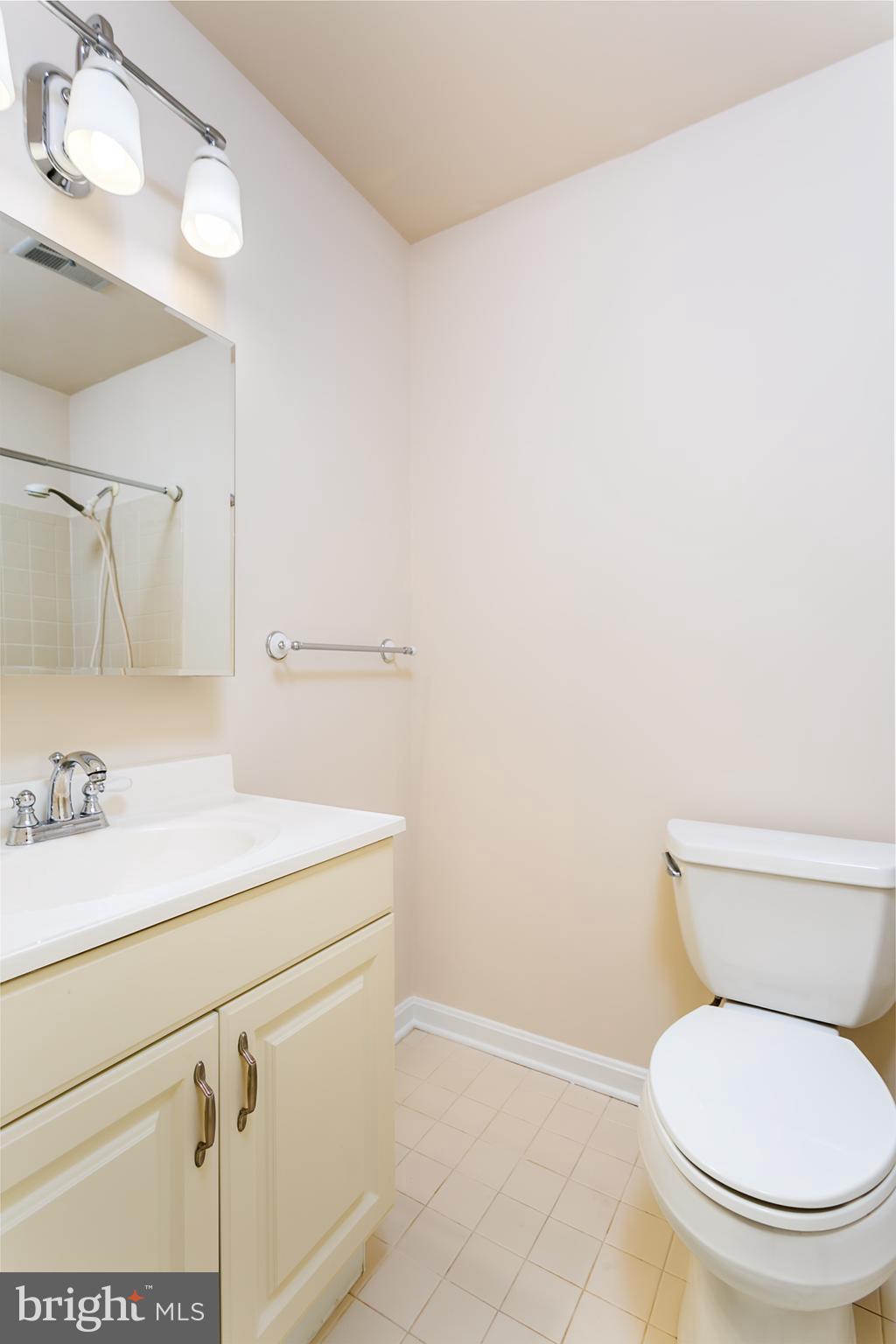33 Kinsman View Circle Silver Spring, MD 20901 - Photo 17 of 26 a bathroom with a sink a toilet and vanity