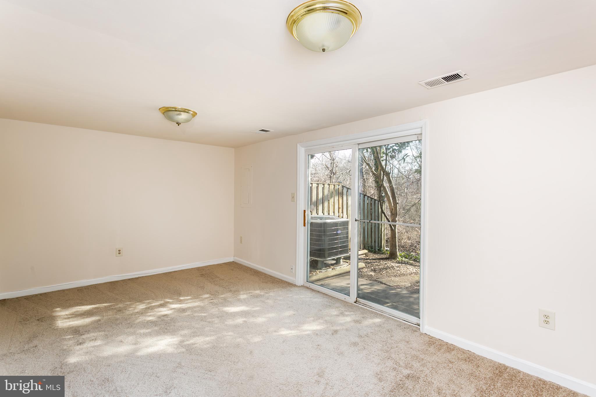 33 Kinsman View Circle Silver Spring, MD 20901 - Photo 21 of 26 a view of an empty room and window