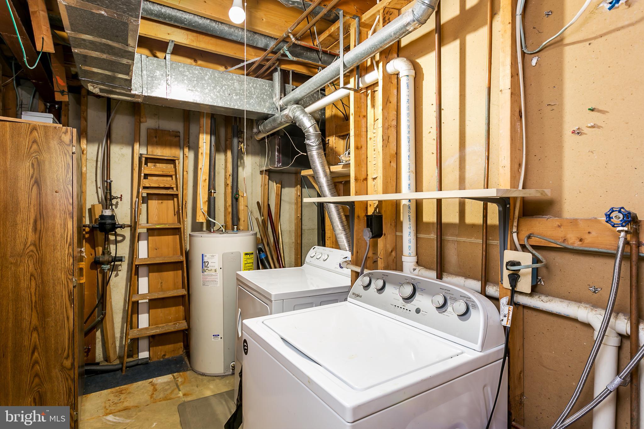 33 Kinsman View Circle Silver Spring, MD 20901 - Photo 23 of 26 a storage room with washer and dryer