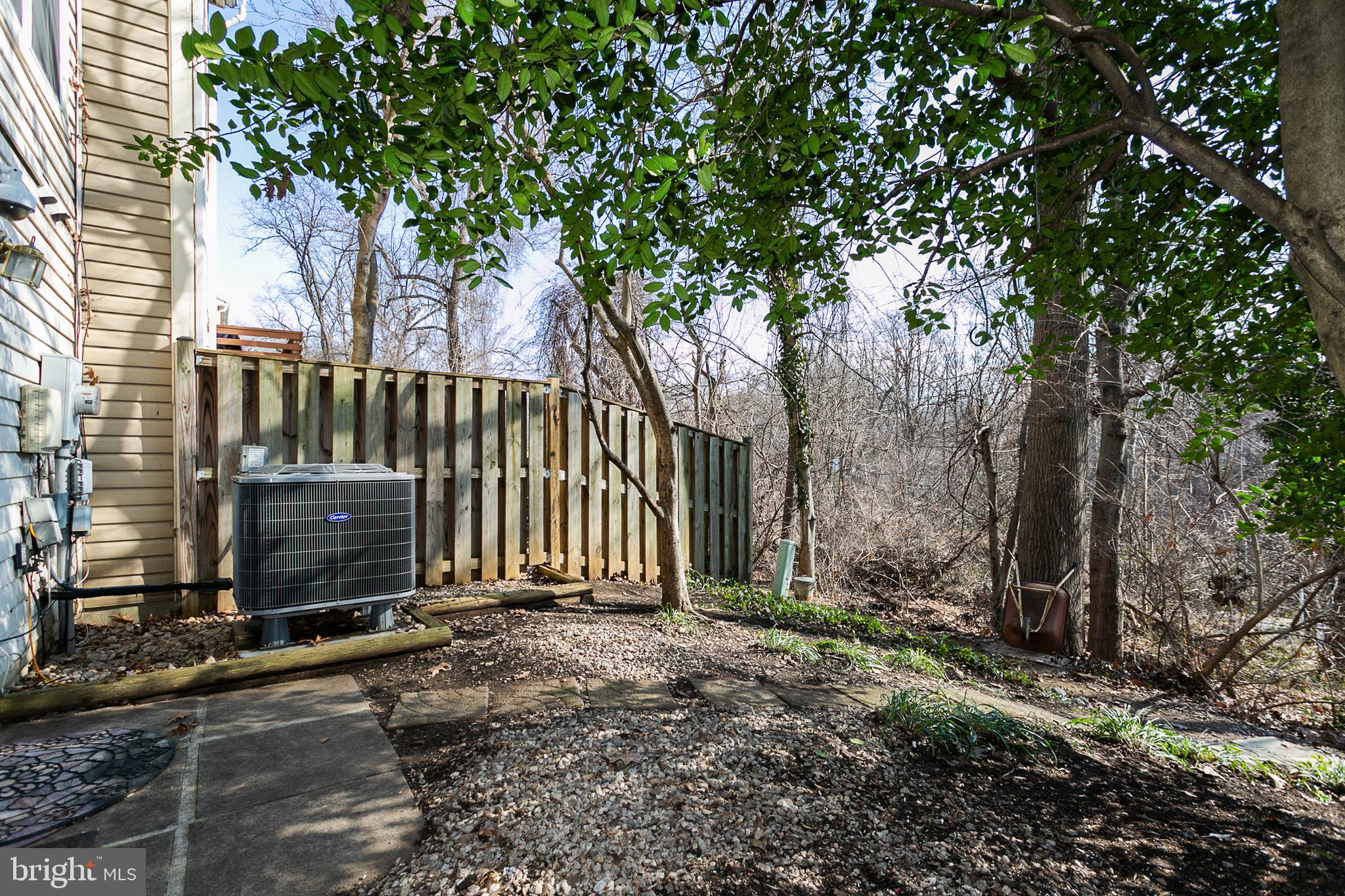 33 Kinsman View Circle Silver Spring, MD 20901 - Photo 25 of 26 a view of a backyard with a tree