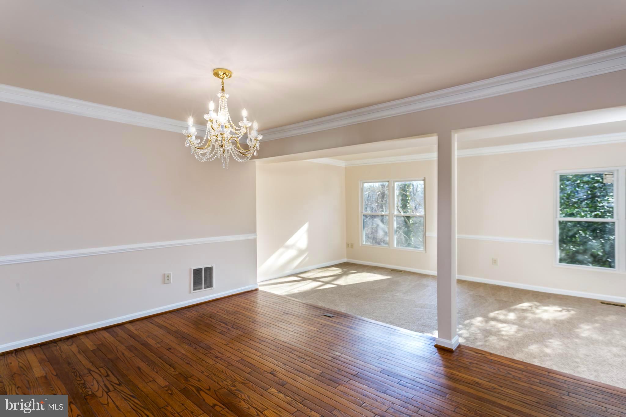 33 Kinsman View Circle Silver Spring, MD 20901 - Photo 6 of 26 a view of a livingroom with wooden floor and a large window