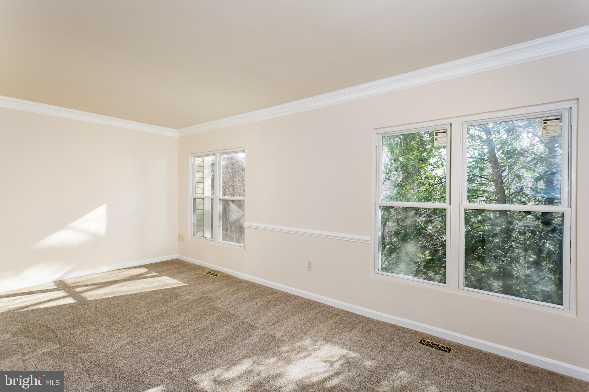 33 Kinsman View Circle Silver Spring, MD 20901 - Photo 7 of 26 a view of an empty room with a window