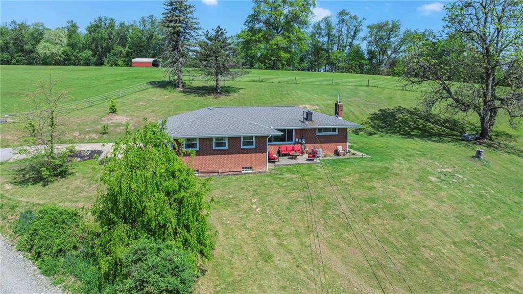 383 Ridgemont Drive Midland, PA 15059 - Photo 5 of 44 a view of a house with a big yard