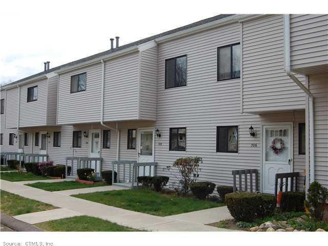 305 Timber Lane, Unit 305 Canton, CT 06019 - Photo 1 of 1 a view of a house with a yard