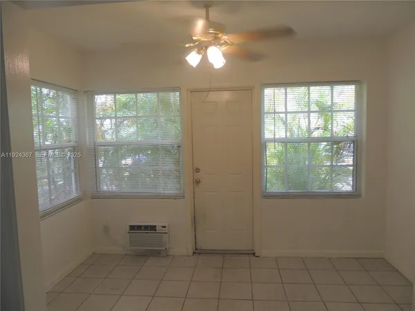 a view of an empty room with a window