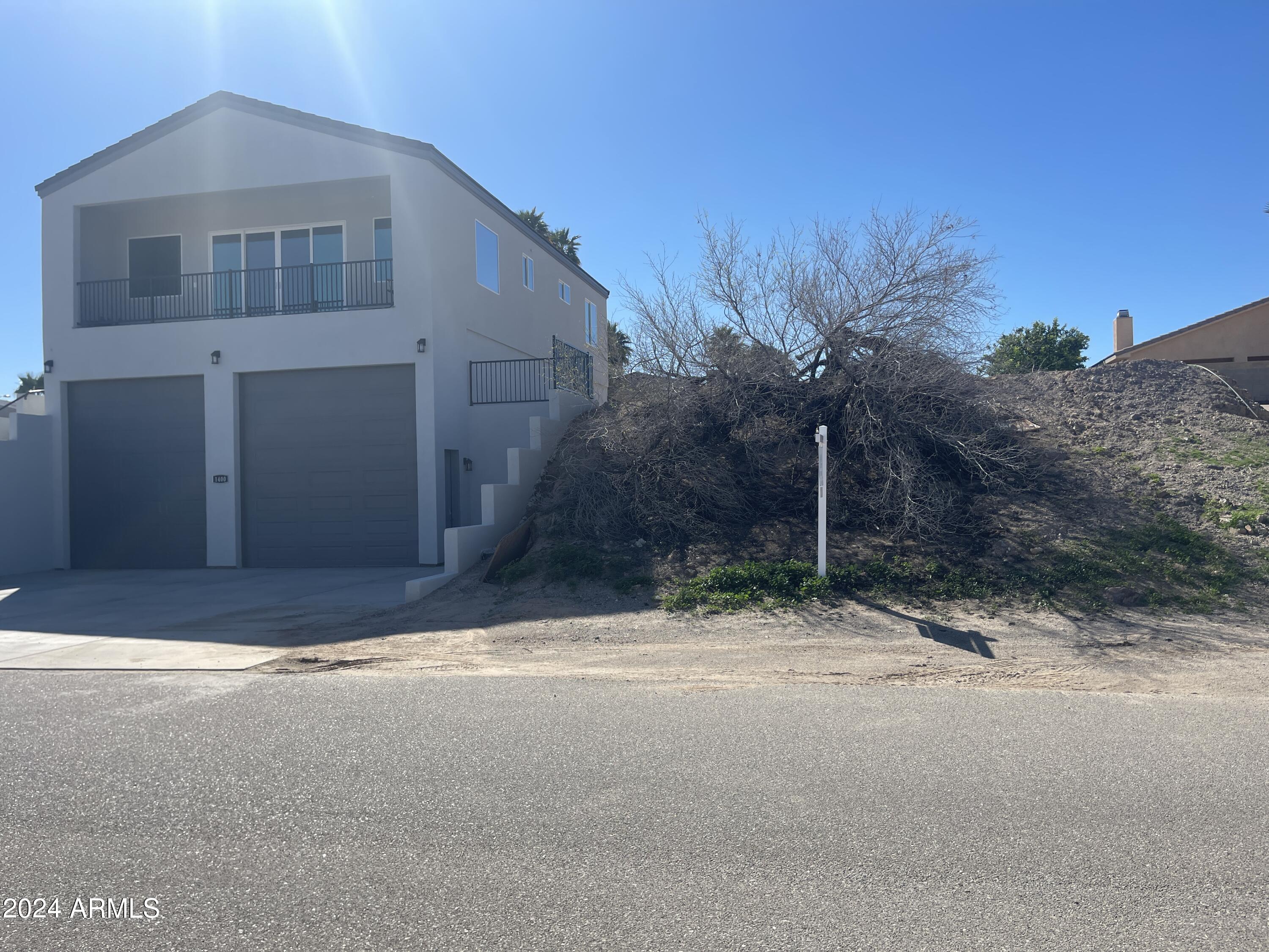 1394 Riverfront Drive, Unit 66 Bullhead City, AZ 86442 - Photo 2 of 11 a view of a house with a yard