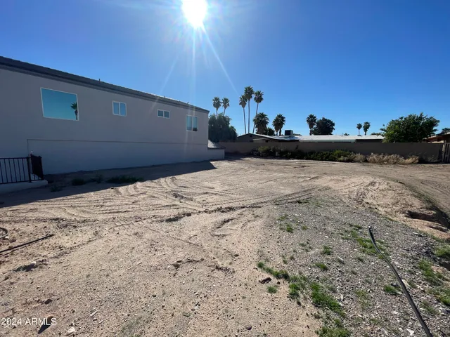 a view of a backyard of the house