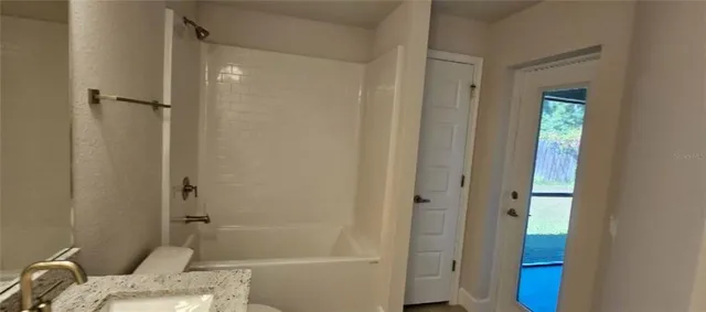 a bathroom with a sink and a shower
