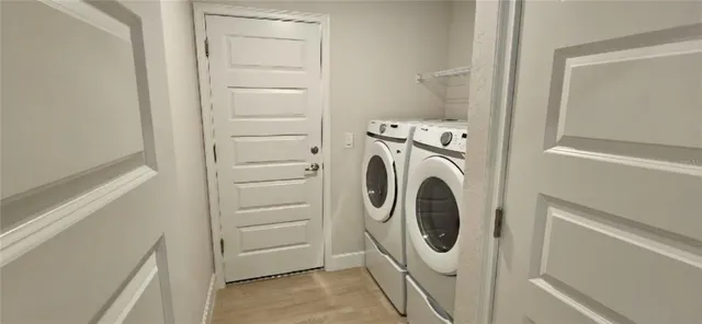 a utility room with dryer and washer