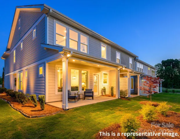 a view of a house with swimming pool and porch