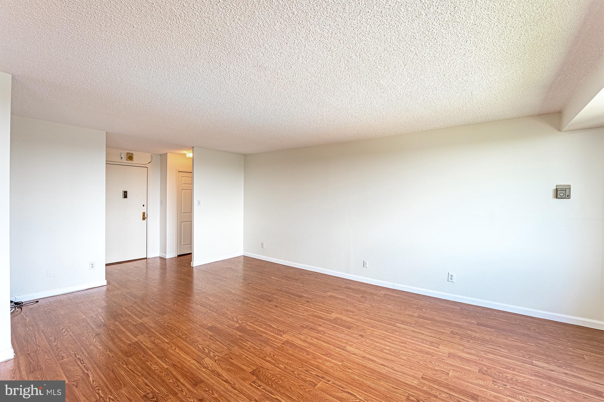 5225 Pooks Hill Road, Unit 721S Bethesda, MD 20814 - Photo 6 of 22 a view of an empty room and wooden floor