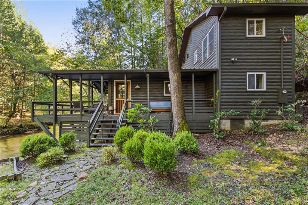 129 Old Bend Road Blue Ridge, GA 30513 - Photo 30 of 44 a front view of a house with garden