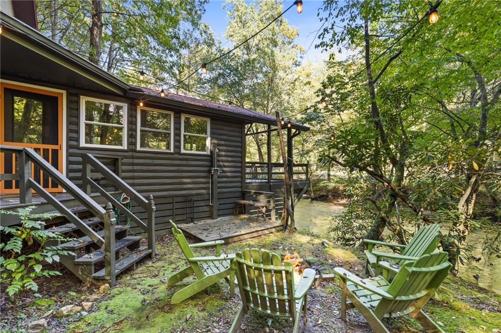 129 Old Bend Road Blue Ridge, GA 30513 - Photo 31 of 44 a view of an house with backyard
