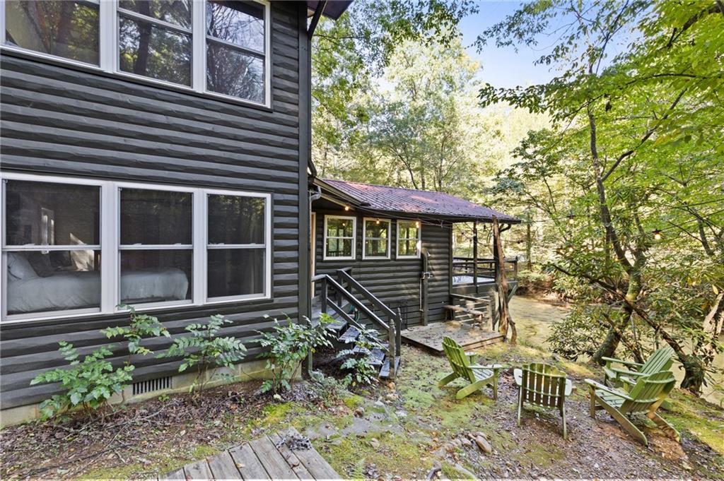 129 Old Bend Road Blue Ridge, GA 30513 - Photo 42 of 44 a house with trees in front of it