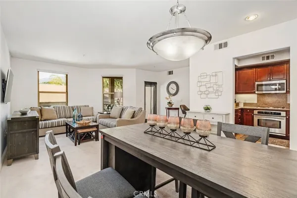a view of a dining room with furniture window and outside view