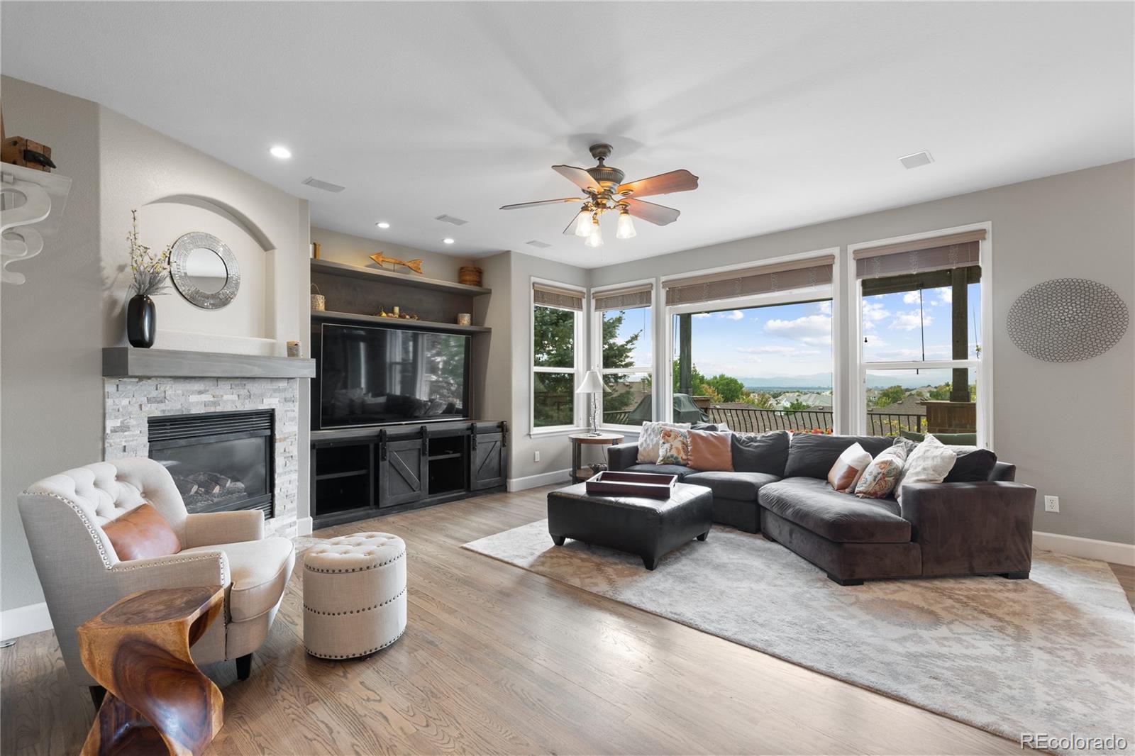 6261 South Sicily Way Aurora, CO 80016 - Photo 13 of 50 a living room with furniture and a fireplace