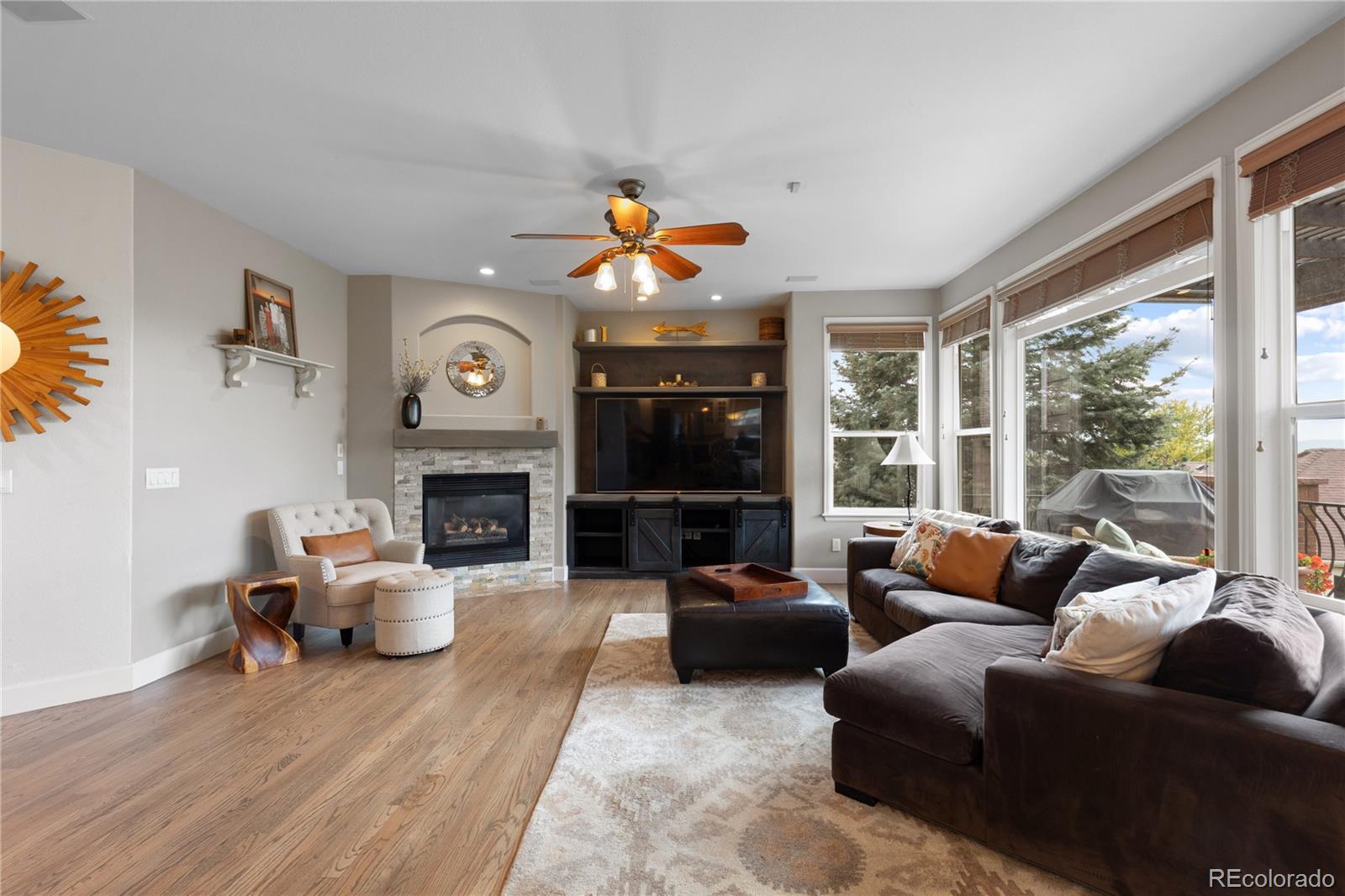 6261 South Sicily Way Aurora, CO 80016 - Photo 15 of 50 a living room with furniture fireplace and a large window