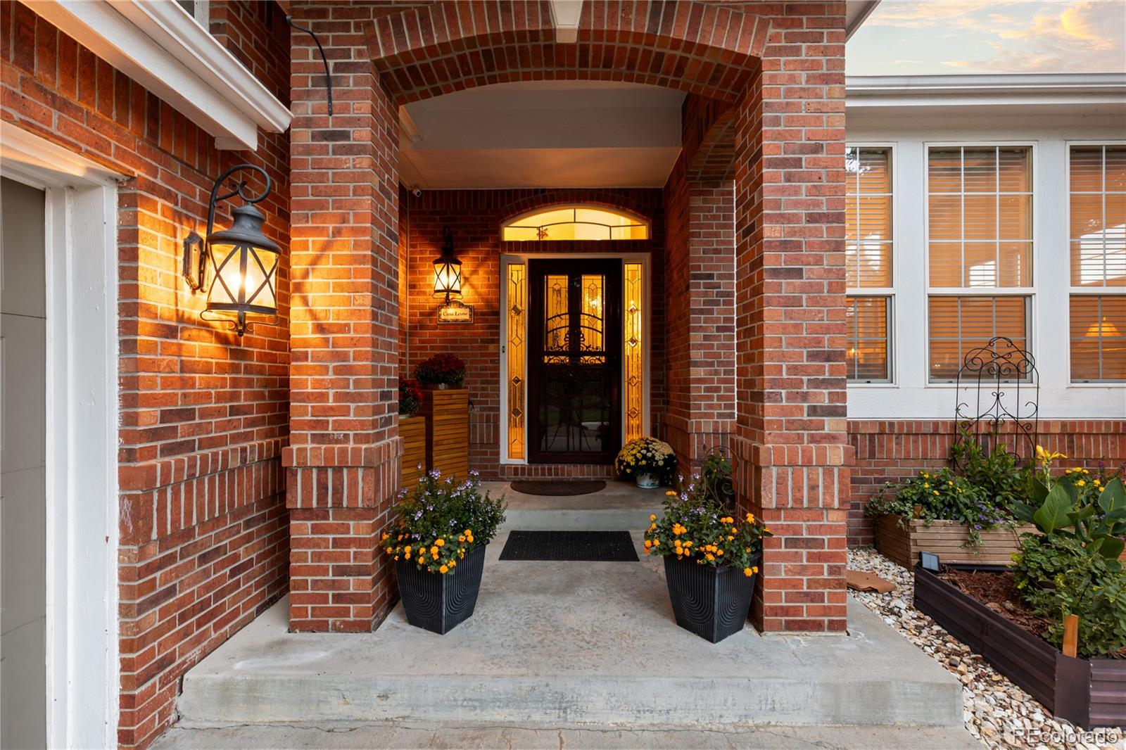 6261 South Sicily Way Aurora, CO 80016 - Photo 5 of 50 a front view of a house with outdoor seating