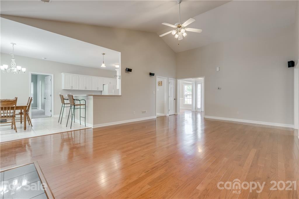 305 Savannah Lane Fort Mill, SC 29708 - Photo 11 of 46 a view of a livingroom with furniture wooden floor and a ceiling fan