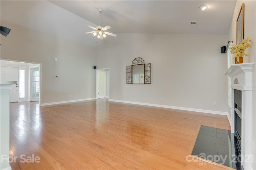 305 Savannah Lane Fort Mill, SC 29708 - Photo 12 of 46 a view of a livingroom with wooden floor and a ceiling fan