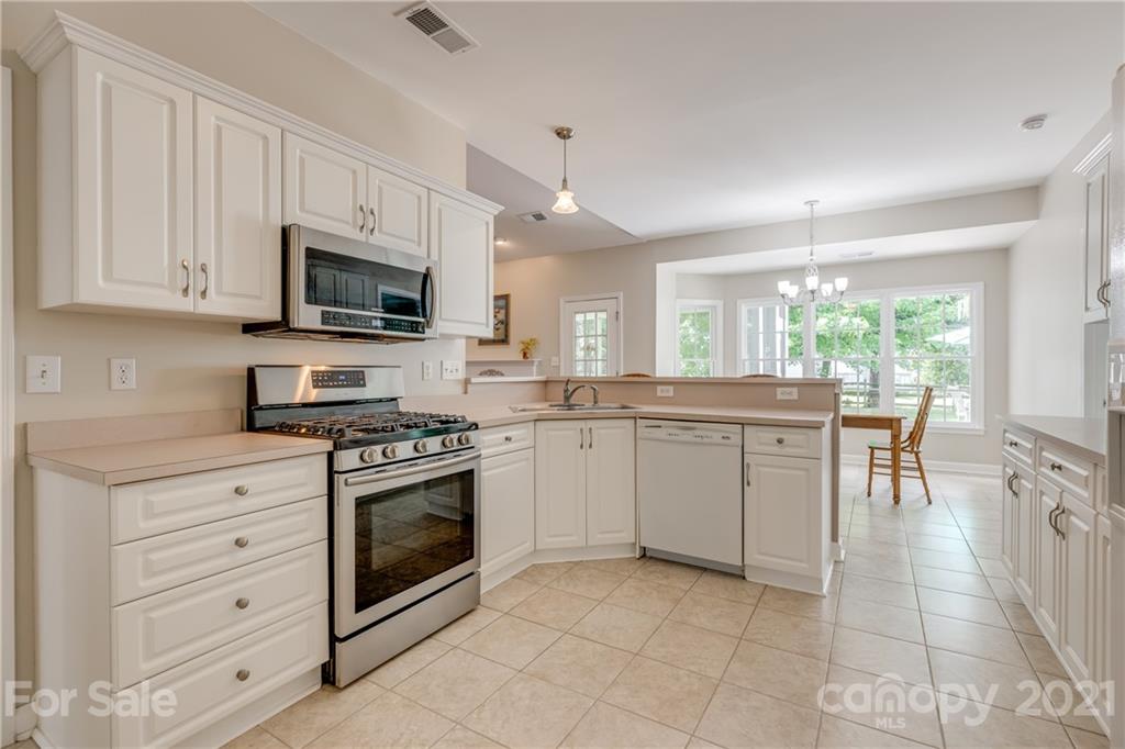 305 Savannah Lane Fort Mill, SC 29708 - Photo 15 of 46 a kitchen with a sink stove and microwave