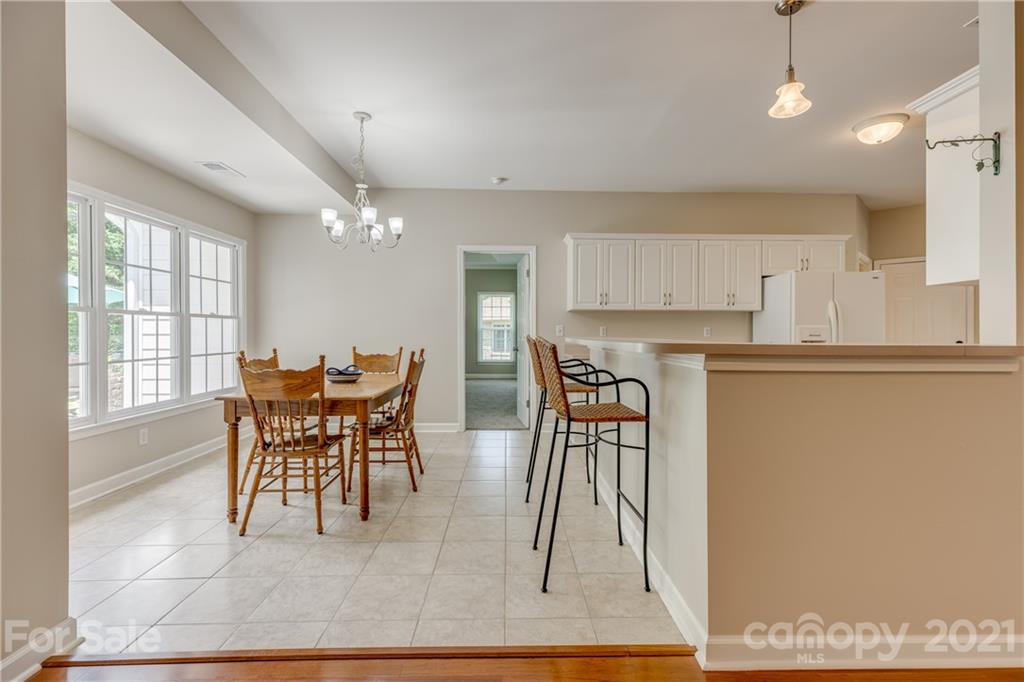 305 Savannah Lane Fort Mill, SC 29708 - Photo 18 of 46 a dining room with furniture and a kitchen view
