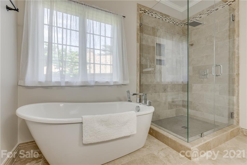 305 Savannah Lane Fort Mill, SC 29708 - Photo 27 of 46 a white bath tub sitting next to a shower
