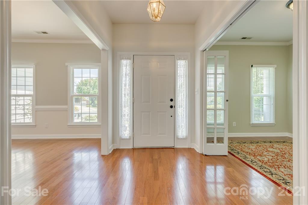 305 Savannah Lane Fort Mill, SC 29708 - Photo 4 of 46 an empty room with wooden floor and windows