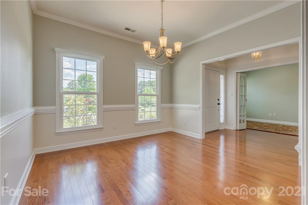 305 Savannah Lane Fort Mill, SC 29708 - Photo 8 of 46 a view of an empty room with wooden floor and a window