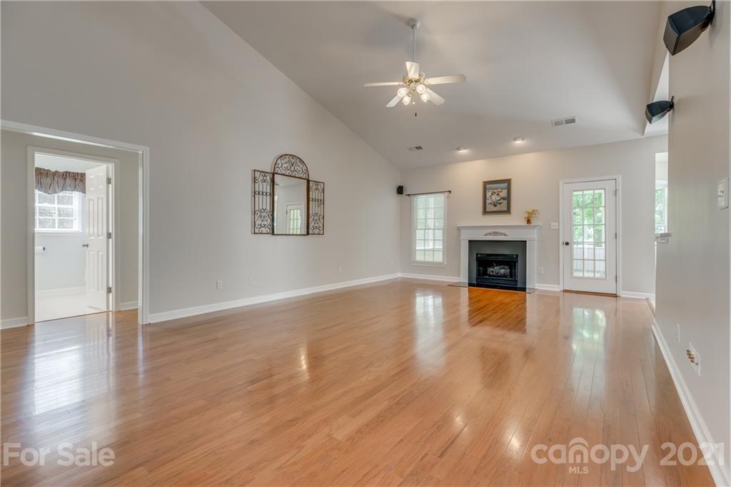 305 Savannah Lane Fort Mill, SC 29708 - Photo 9 of 46 a view of an empty room with window and wooden floor