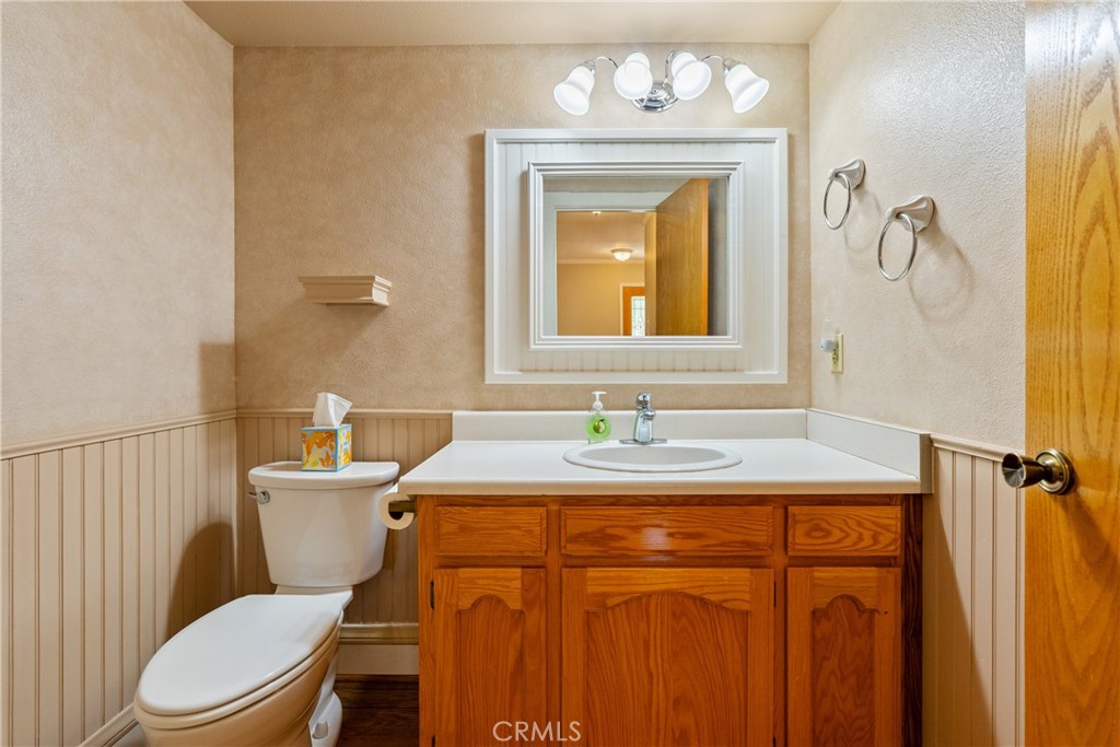 6815 Santa Lucia Road, Unit 5 Atascadero, CA 93422 - Photo 8 of 44 First floor 1/2 bath with decorative wainscoting and thoughtful finishes near the garage entry door.