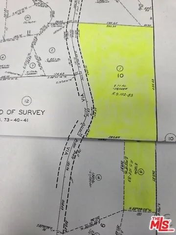 a picture of a bench in front of a window