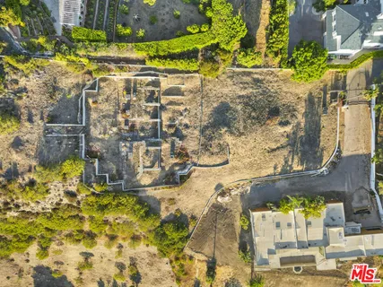 a view of a large body of water with a building in the background