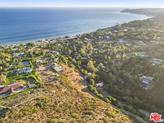 an aerial view of a house and outdoor space