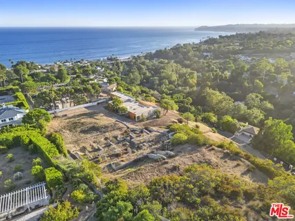 a view of a closet with wooden floor