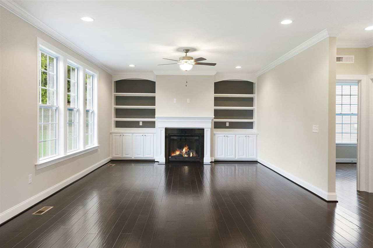 1405 Baxter Ridge Court Apex, NC 27502 - Photo 11 of 25 huge family room with gas fireplace and built ins kitchen to family room