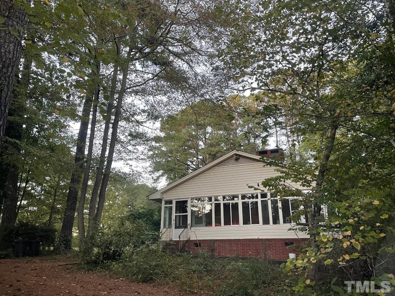 7017 Herndon Road Durham, NC 27713 - Photo 3 of 4 a view of a house with a yard