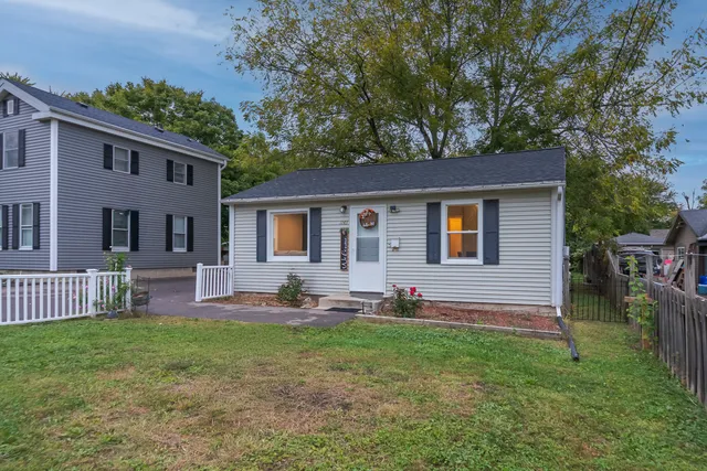 a front view of house with yard and seating area