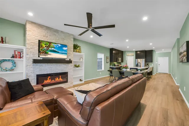 a living room with furniture and a fireplace