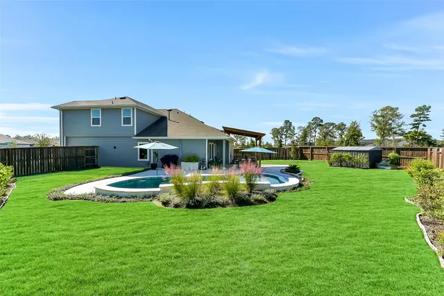 a front view of house with garden