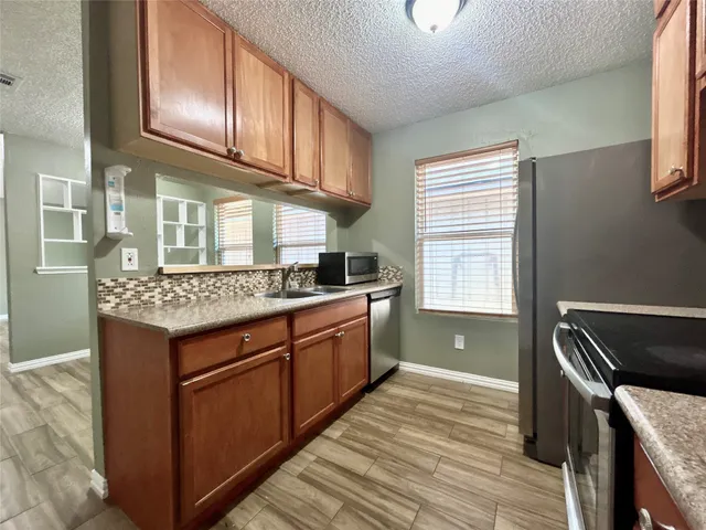 a kitchen with a stove and a microwave