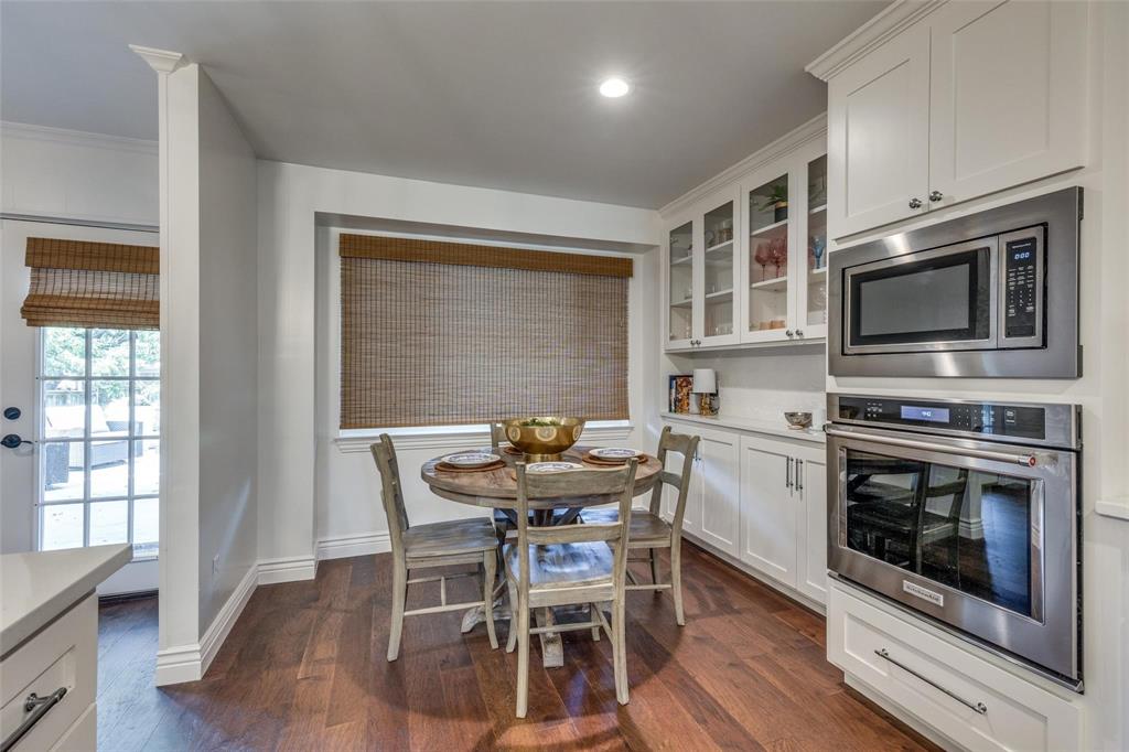 4301 Winding Way Benbrook, TX 76126 - Photo 11 of 25 Kitchen with white cabinets, stainless steel appliances, glass insert cabinets, dark wood-style flooring, and recessed lighting