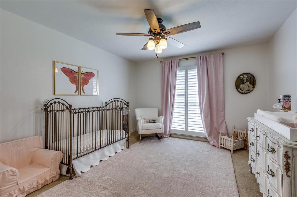 4301 Winding Way Benbrook, TX 76126 - Photo 18 of 25 Bedroom featuring a crib, light colored carpet, and ceiling fan